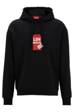 Cotton-terry hoodie with travel-tag artwork